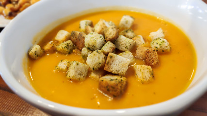 Home prepared vegetable cream soup with croutons