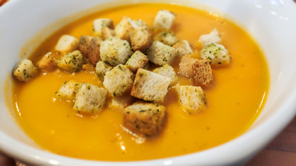 Home prepared vegetable cream soup with croutons