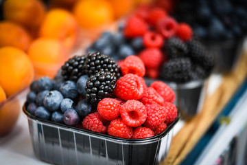 fresh berries close up - strawberries, blueberries, red berries, raspberry, black berries 