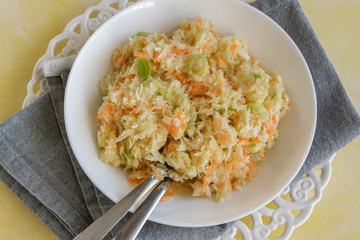 Fresh salad of raw cabbage, leeks and carrots, multivitaminico natural food