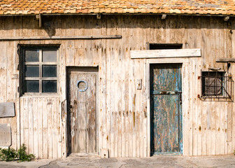 old wooden facade with closed doors