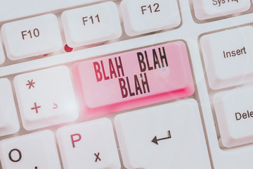 Writing note showing Blah Blah Blah. Business concept for Talking too much false information gossips nonsense speaking Keyboard with note paper on white background key copy space