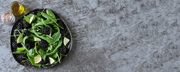 Healthy salad with arugula, blackberry and lime. Diet food.