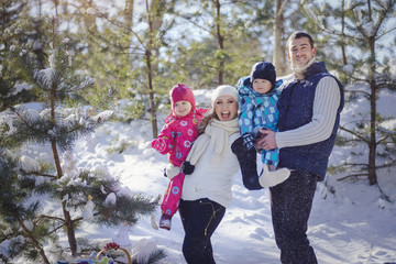 Attractive family having fun in a winter park