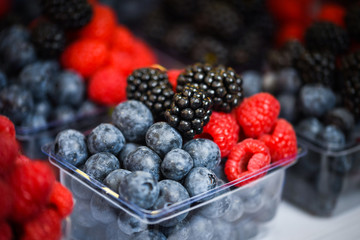 fresh berries close up - strawberries, blueberries, red berries, raspberry, black berries 