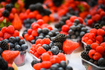 fresh berries close up - strawberries, blueberries, red berries, raspberry, black berries 