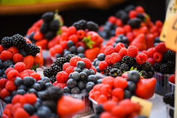 fresh berries close up - strawberries, blueberries, red berries, raspberry, black berries 