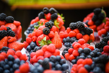 fresh berries close up - strawberries, blueberries, red berries, raspberry, black berries 
