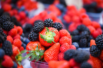 fresh berries close up - strawberries, blueberries, red berries, raspberry, black berries 