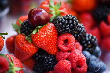fresh berries close up - strawberries, blueberries, red berries, raspberry, black berries 