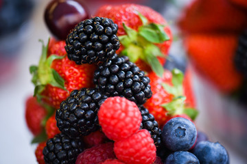 fresh berries close up - strawberries, blueberries, red berries, raspberry, black berries 