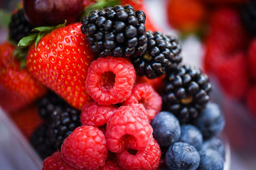 fresh berries close up - strawberries, blueberries, red berries, raspberry, black berries 