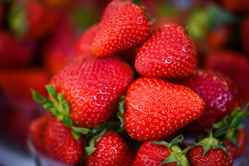 fresh strawberries close up within the fruits market in Prague