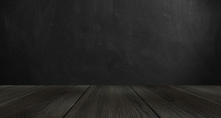 Dark room, wooden table. Empty stage with a table.