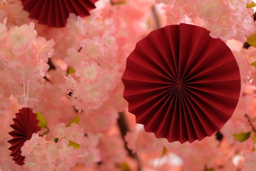 close up traditional Japanese paper art (Origami ) with blur pink sakura background. Japanese culture concept