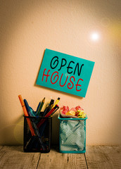 Text sign showing Open House. Business photo text a place or situation in which all visitors are welcome to go in Blue Sticky Card on Wall Two Pencil Pots Pens Pencils Markers Waste Paper