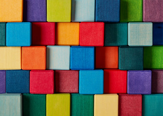 Fototapeta na wymiar Multi-colored toy cubes background