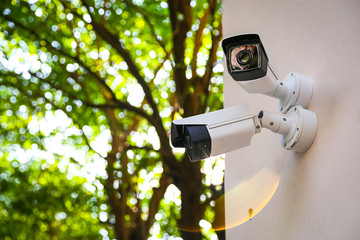 Outdoor CCTV monitoring, security cameras with sunlight flare. - obrazy, fototapety, plakaty