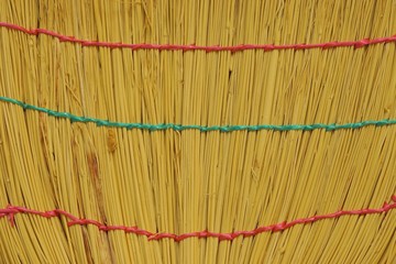 Broom from rods. Brush of  bound straw close up