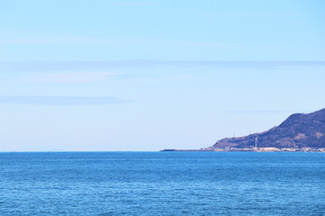 Fototapeta na wymiar 日本海の水平線と入江