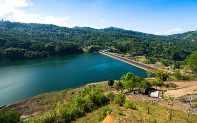 Fototapeta na wymiar The Kotmale Dam is a irrigation dam in Kotmale, Sri Lanka. The dam generates power from three 67 MW turbines, total making it the second largest hydroelectric power station in Sri Lanka.