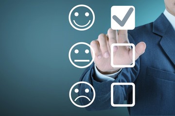Businessman touch in rating with a happy icon