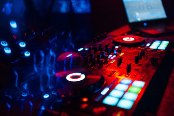 Fototapeta na wymiar professional DJ mixer on table in nightclub