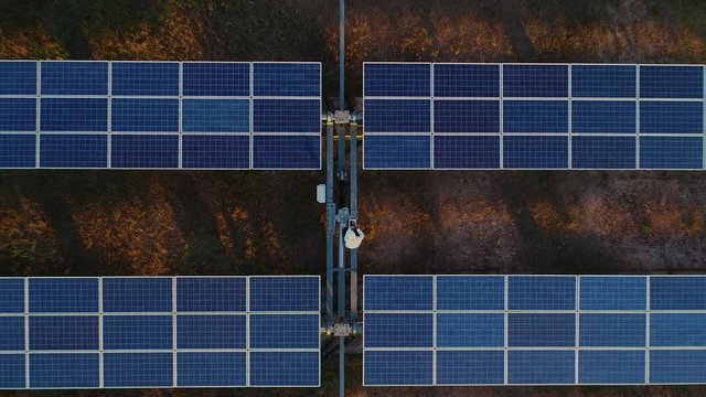Technician and investor Using Infrared Drone Technology to Inspect Solar Panels and Wind Turbines in Solar cell Farm, Solar cells will be an important renewable energy of the future.
