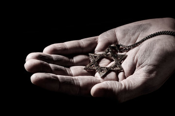 the star of david in the hand of a man