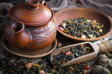 Dried leaf tea on old background