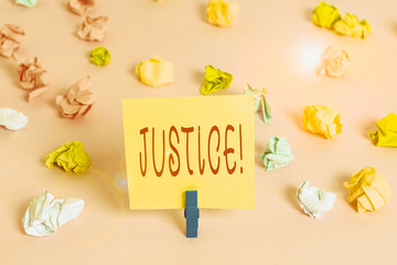 Writing note showing Justice. Business concept for impartial adjustment of conflicting claims or...