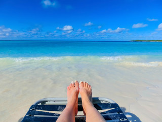 Obraz premium picture of male legs over tropical beach background
