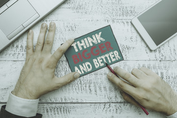 Writing note showing Think Bigger And Better. Business concept for no Limits be Open minded...