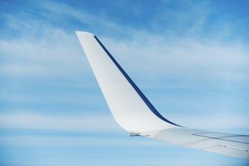 wing of airplane in sky