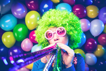 Portrait of beautiful party woman in wig and glasses (Carneval).