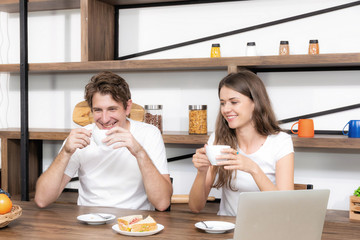 Fototapeta premium Happy couple eating breakfast together at home.