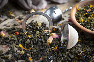 Dried leaf tea on old background