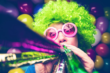 Portrait of beautiful party woman in wig and glasses (Carneval).