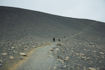 Iceland landscape. Clambering into a volcano, Long path to a scenic crater edge.