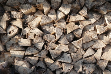 Folded stacks of firewood, background texture wood 