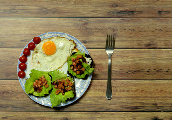Still life with fried eggs, sandwiches, tomatoes, folk