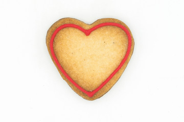 Obraz na płótnie Canvas heart shaped gingerbread cookies on white background