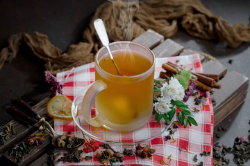 Tea hot drink on old background in composition on the table