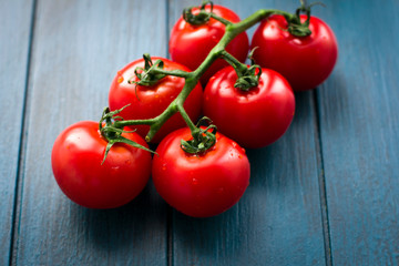 fresh red tomatoes on the vine