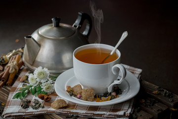 Tea in a cup on an old background