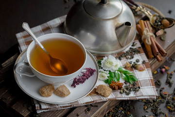 Tea in a cup on an old background