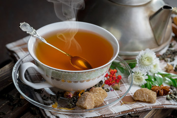 Tea in a cup on an old background