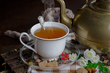 Tea in a cup on an old background