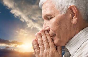 Praying.