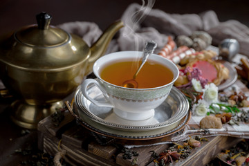 Tea in a cup on an old background